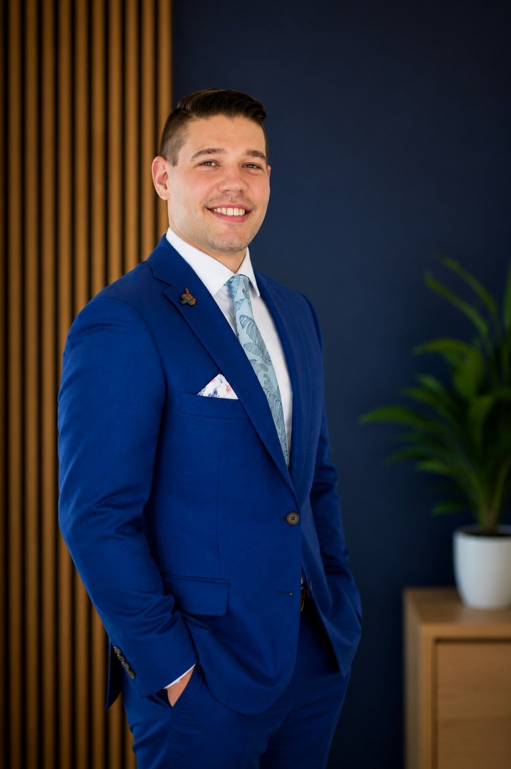 Founder and Principal of On The Mark, standing in a modern office